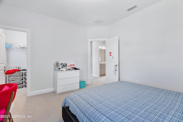 144 Waverly Way, Saint Johns, FL 32259 - bedroom with light colored carpet, a walk in closet, a closet, and baseboards