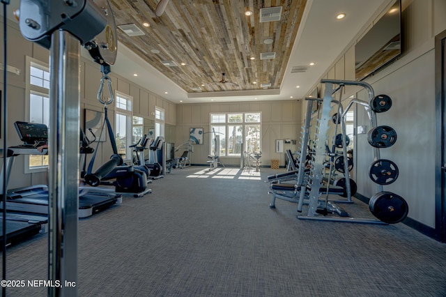 144 Waverly Way, Saint Johns, FL 32259 - workout area with a tray ceiling, carpet flooring, and a decorative wall