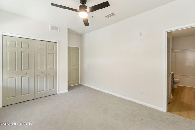 2330 Golden Lake Loop, Saint Augustine, FL 32084 - unfurnished bedroom with carpet, a closet, baseboards, and connected bathroom