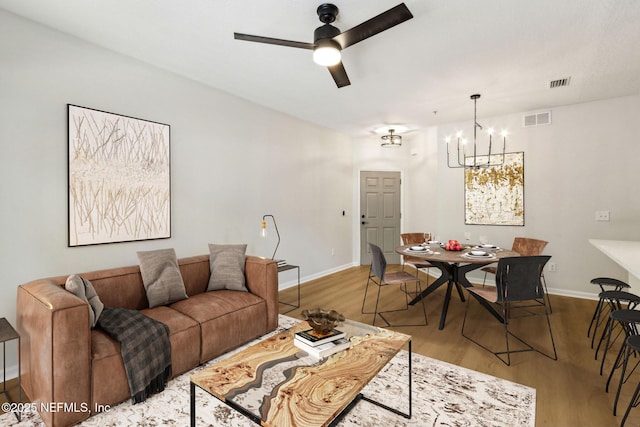 2330 Golden Lake Loop, Saint Augustine, FL 32084 - living area featuring a chandelier, wood finished floors, a ceiling fan, and baseboards