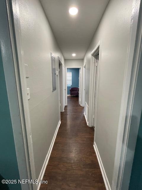 10566 Arendal Rd, Jacksonville, FL 32218 - hall with dark wood-style floors, baseboards, and recessed lighting