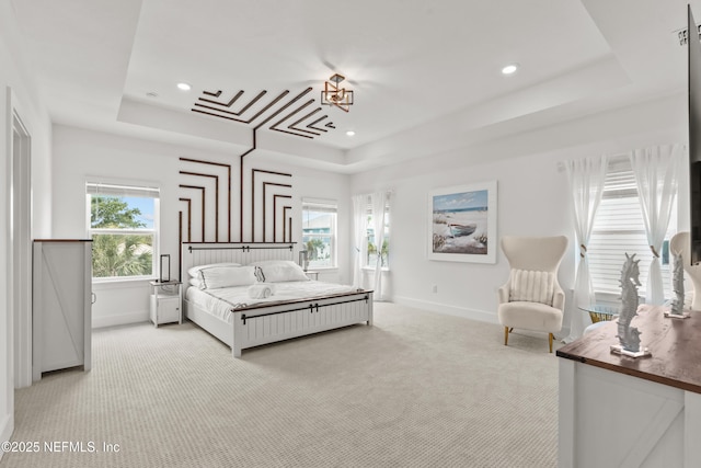 bedroom featuring a raised ceiling, carpet, baseboards, multiple windows, and recessed lighting