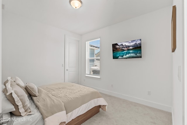 carpeted bedroom with baseboards