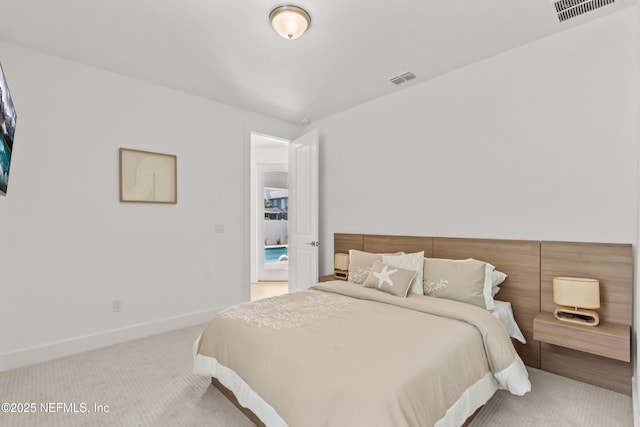 carpeted bedroom featuring baseboards