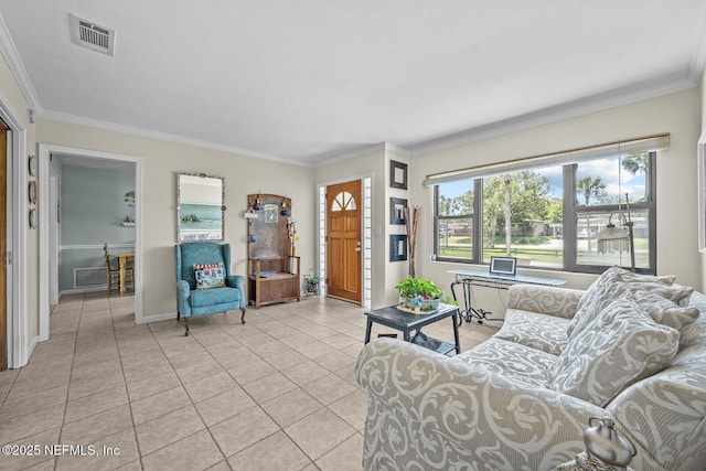 living area with light tile patterned flooring, ornamental molding, and baseboards
