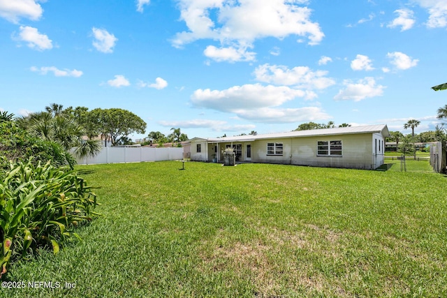 rear view of property with metal roof