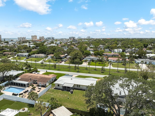 aerial view of residential area with a pool