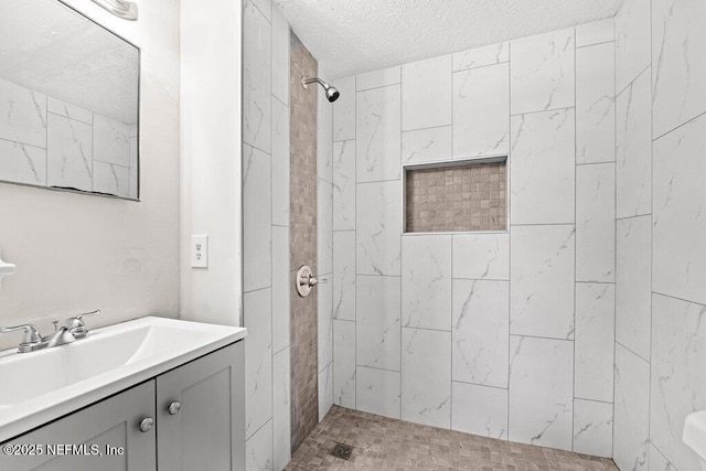 4504 Lincrest Dr S, Jacksonville, FL 32208 - bathroom featuring tiled shower, a textured ceiling, and vanity