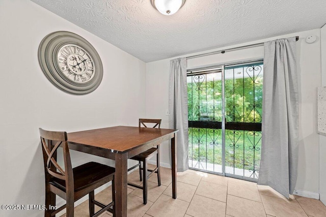 4504 Lincrest Dr S, Jacksonville, FL 32208 - dining space with light tile patterned floors and a textured ceiling