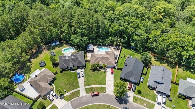 2007 Eclipse Dr, Middleburg, FL 32068 - aerial view of residential area with a pool and a heavily wooded area