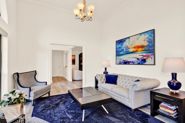 108 Spanish Moss Ln, Ponte Vedra Beach, FL 32082 - living area featuring wood finished floors, crown molding, a chandelier, baseboards, and arched walkways