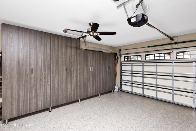 108 Spanish Moss Ln, Ponte Vedra Beach, FL 32082 - garage with a garage door opener, a ceiling fan, and wood walls