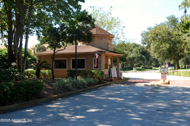 108 Spanish Moss Ln, Ponte Vedra Beach, FL 32082 - view of front of house featuring stucco siding and a shingled roof