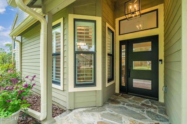 33 Loggerhead Ln, Ponte Vedra Beach, FL 32082 - view of exterior entry featuring covered porch