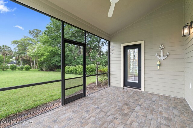 33 Loggerhead Ln, Ponte Vedra Beach, FL 32082 - unfurnished sunroom with a ceiling fan and vaulted ceiling