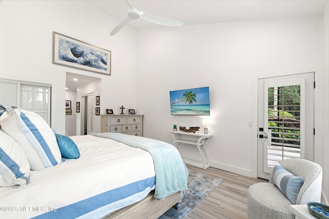 33 Loggerhead Ln, Ponte Vedra Beach, FL 32082 - bedroom with access to exterior, a high ceiling, wood finished floors, baseboards, and ceiling fan