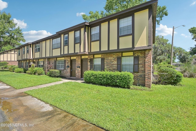 4813 Cherwell Ln Unit B-4-C, Jacksonville, FL 32217 - view of front of property featuring brick siding and a front lawn