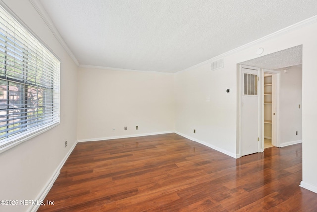 4813 Cherwell Ln Unit B-4-C, Jacksonville, FL 32217 - spare room featuring a textured ceiling, wood finished floors, crown molding, and baseboards