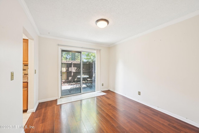 4813 Cherwell Ln Unit B-4-C, Jacksonville, FL 32217 - spare room with crown molding, wood finished floors, baseboards, and a textured ceiling