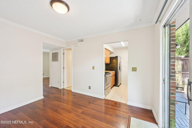 4813 Cherwell Ln Unit B-4-C, Jacksonville, FL 32217 - spare room with light wood-style floors, baseboards, and crown molding