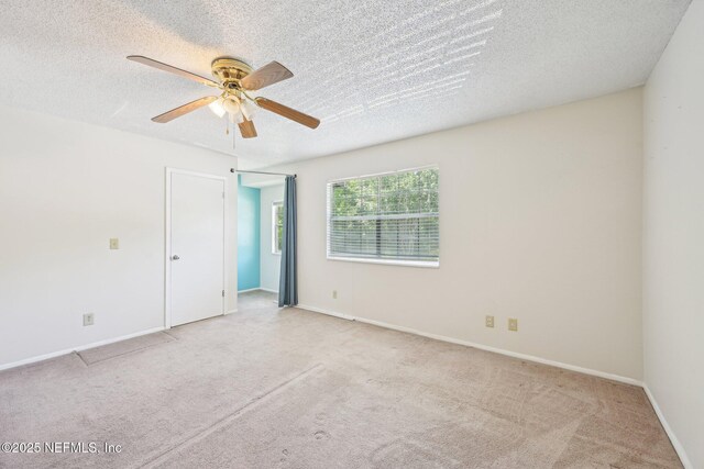 4813 Cherwell Ln Unit B-4-C, Jacksonville, FL 32217 - unfurnished room with ceiling fan, carpet flooring, a textured ceiling, and baseboards