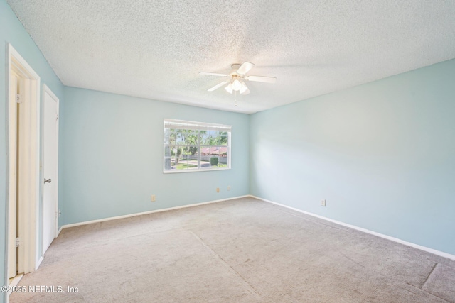 4813 Cherwell Ln Unit B-4-C, Jacksonville, FL 32217 - unfurnished bedroom with carpet floors, baseboards, a textured ceiling, and ceiling fan