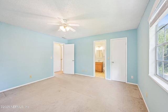 4813 Cherwell Ln Unit B-4-C, Jacksonville, FL 32217 - unfurnished bedroom with multiple windows, light carpet, baseboards, and a textured ceiling