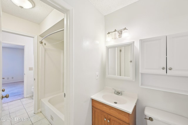 4813 Cherwell Ln Unit B-4-C, Jacksonville, FL 32217 - full bathroom featuring toilet, a textured ceiling, vanity,  shower combination, and tile patterned floors