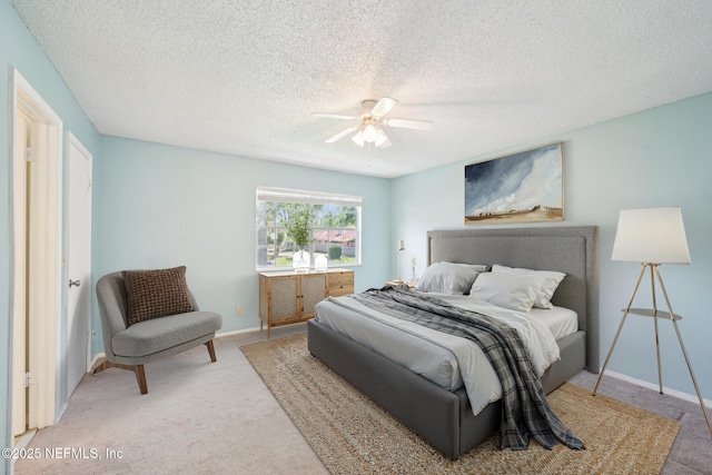 4813 Cherwell Ln Unit B-4-C, Jacksonville, FL 32217 - carpeted bedroom with a ceiling fan, baseboards, and a textured ceiling