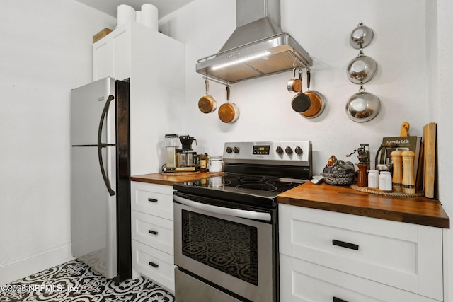 1267 Murray Dr, Jacksonville, FL 32205 - kitchen with appliances with stainless steel finishes, butcher block counters, wall chimney exhaust hood, and white cabinets