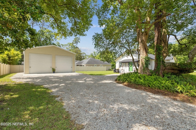 1267 Murray Dr, Jacksonville, FL 32205 - view of home's exterior featuring an outbuilding and a detached garage