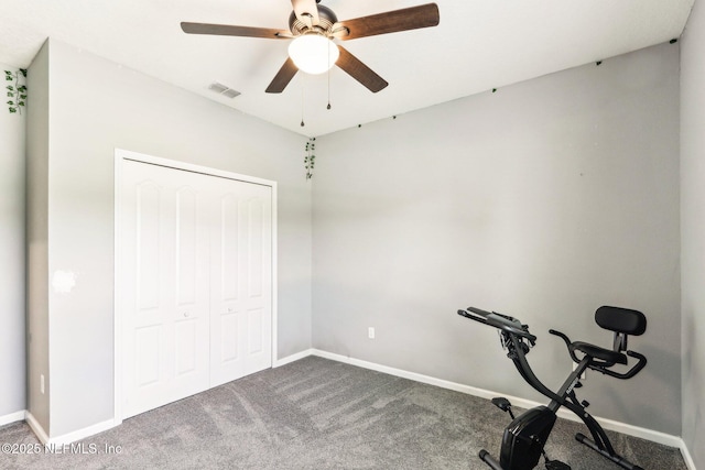 workout area featuring carpet flooring, a ceiling fan, and baseboards