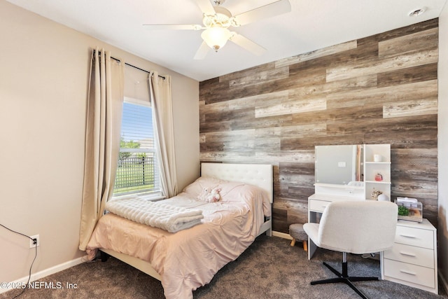 bedroom featuring wood walls, carpet flooring, baseboards, and ceiling fan