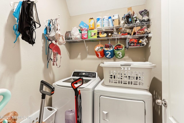laundry area with washing machine and clothes dryer