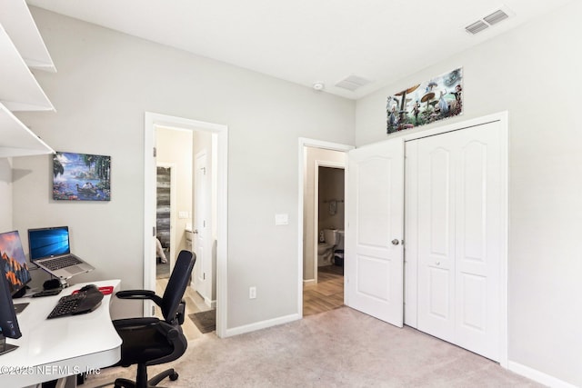 office space featuring carpet and baseboards