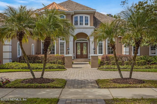 2624 Oakgrove Ave, Saint Augustine, FL 32092 - mediterranean / spanish-style house with french doors and stucco siding