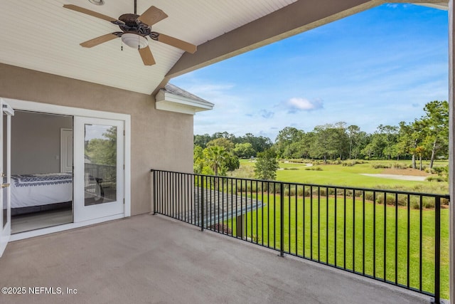 2624 Oakgrove Ave, Saint Augustine, FL 32092 - balcony featuring a ceiling fan and view of scattered trees