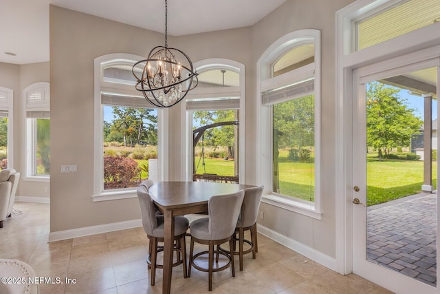 2624 Oakgrove Ave, Saint Augustine, FL 32092 - dining space featuring plenty of natural light, baseboards, a chandelier, and light tile patterned floors