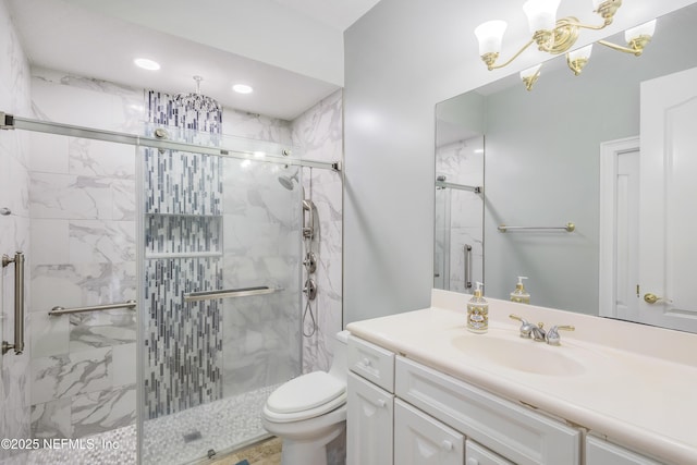 2624 Oakgrove Ave, Saint Augustine, FL 32092 - bathroom featuring vanity, a stall shower, toilet, a chandelier, and recessed lighting