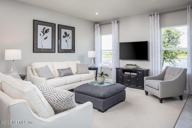 living room featuring plenty of natural light and recessed lighting