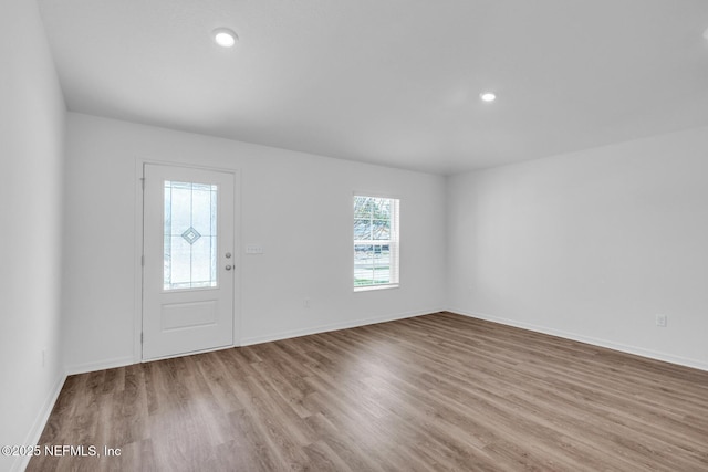 37143 Whippoorwill Ct, Hilliard, FL 32046 - foyer entrance with wood finished floors, baseboards, and recessed lighting