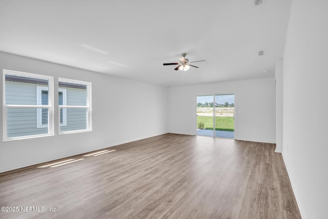 37143 Whippoorwill Ct, Hilliard, FL 32046 - unfurnished room featuring wood finished floors, ceiling fan, and baseboards