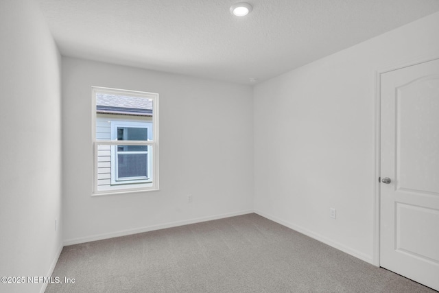 37143 Whippoorwill Ct, Hilliard, FL 32046 - carpeted spare room with baseboards and a textured ceiling