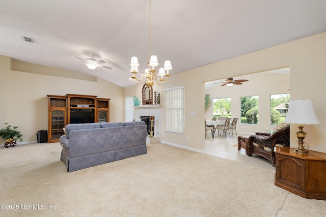 1530 Blue Heron Ct, Fleming Island, FL 32003 - living area with ceiling fan, a tile fireplace, carpet floors, baseboards, and vaulted ceiling