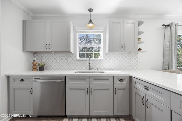 kitchen with dishwasher, a sink, gray cabinets, and crown molding