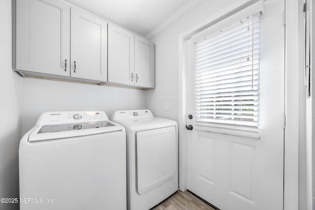 washroom with independent washer and dryer, cabinet space, crown molding, and light wood finished floors