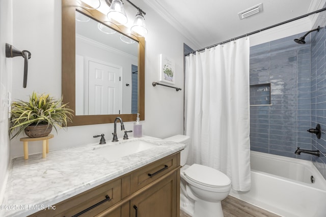 full bath featuring ornamental molding, toilet, shower / bath combo, vanity, and wood finished floors