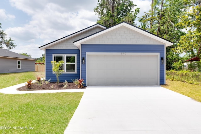 959 Florida St, Fleming Island, FL 32003 - single story home with driveway, a front lawn, and an attached garage