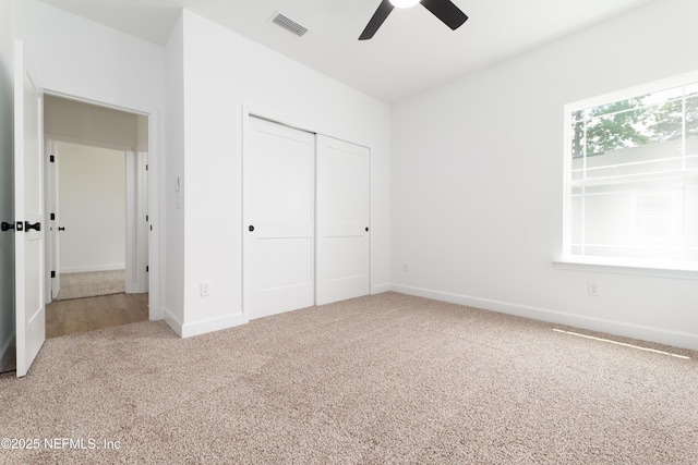 959 Florida St, Fleming Island, FL 32003 - unfurnished bedroom with carpet flooring, baseboards, a closet, and a ceiling fan