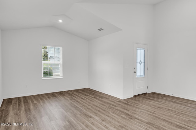 37322 Whisper Way, Hilliard, FL 32046 - unfurnished room featuring wood finished floors, lofted ceiling, and baseboards